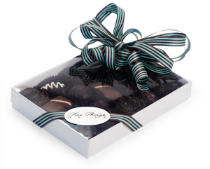 Chocolates in a white box with clear lid